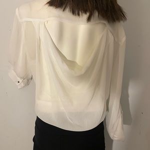 Jennifer Lopez sheer white Gorgeous blouse with a cut out back. Totally stylish